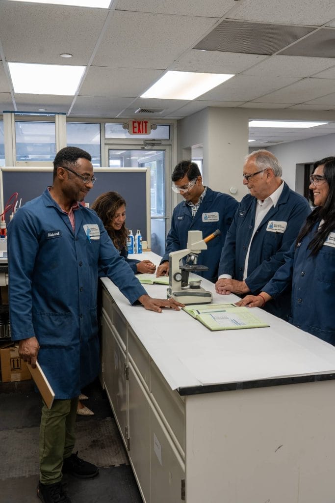 Innovative Resin Systems team reviewing work together in the laboratory